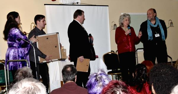 Patricia being presented with art